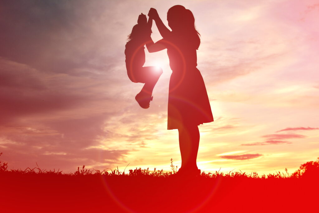 silhouette mother playing with daughter field against sky sunset